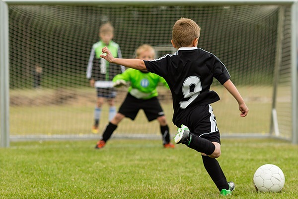 concussion-home-m Child playing soccer, a potential for concussion